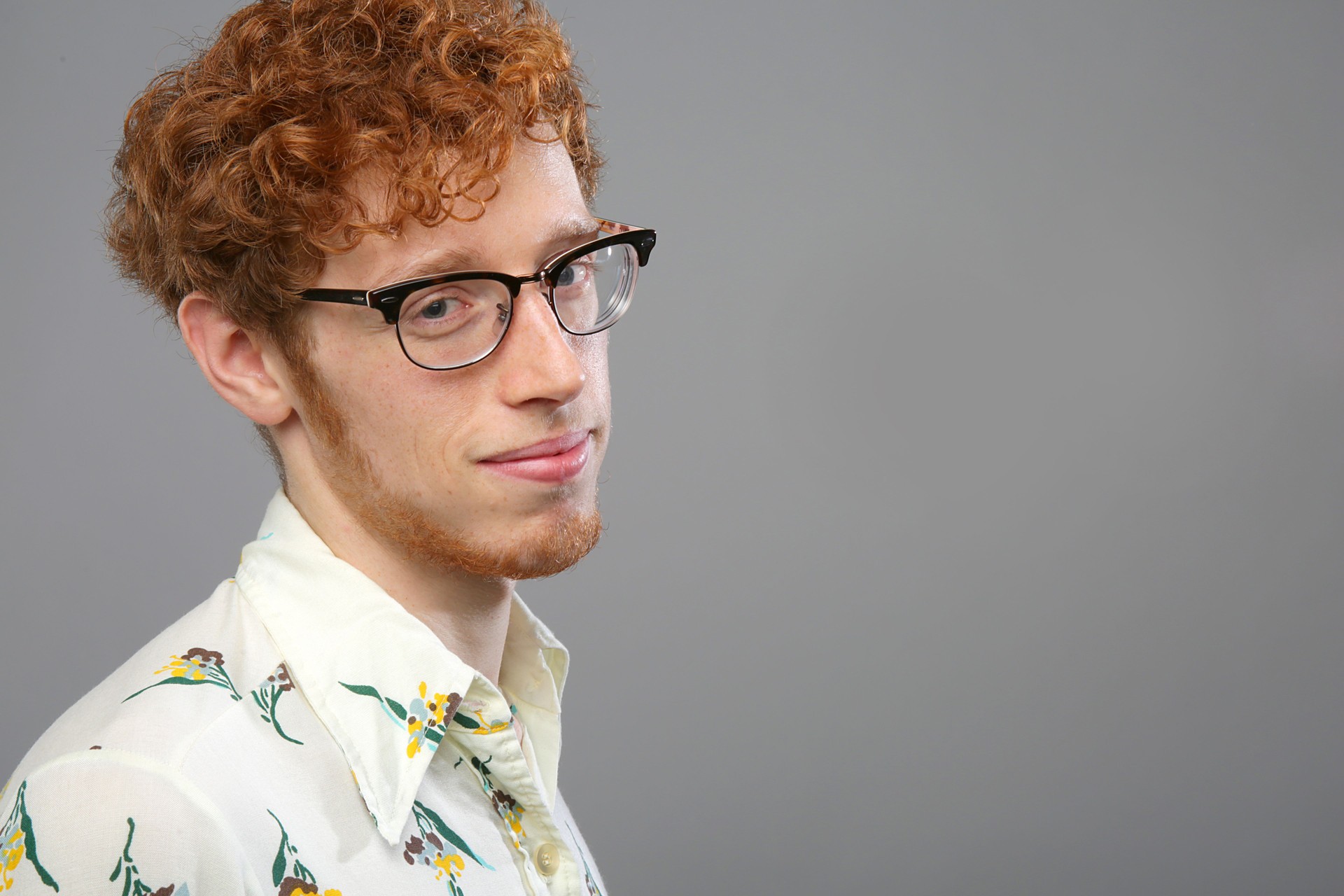 hipster in glasses looking at camera